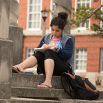 student sitting on quad
