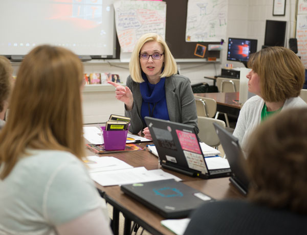 An instructor teaches her students about educational administration.