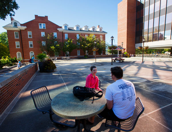 Students chat outside DeGarmo Hall.