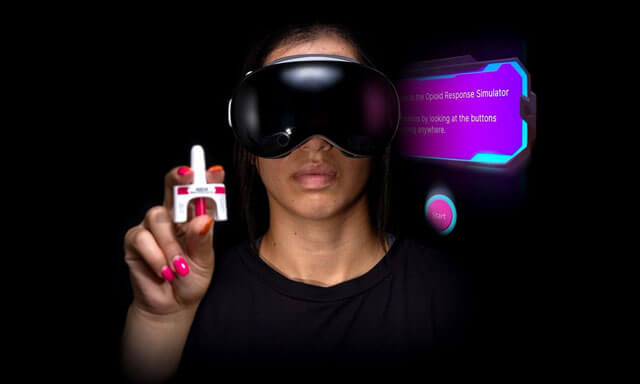 A person wearing a VR headset holds a small white object with a red tip, with a glowing screen in the background.