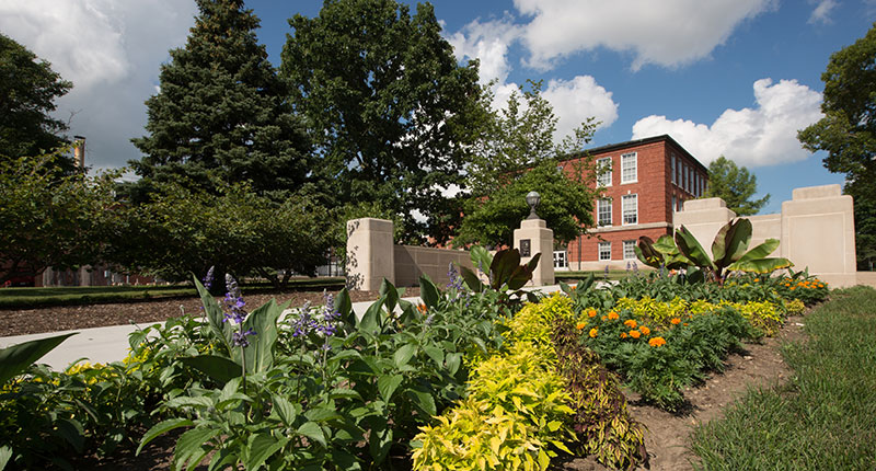 Flower bed in front of the Lincoln gate entrance to campus.